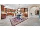 Eat-in kitchen with granite countertops, a chandelier, wooden cabinets, and stainless steel appliances at 2383 E Zion Way, Chandler, AZ 85249