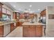 Gourmet kitchen with an island, granite countertops, and stainless steel appliances for culinary enthusiasts at 2383 E Zion Way, Chandler, AZ 85249