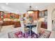Open kitchen and breakfast area featuring wood cabinets and natural light at 2383 E Zion Way, Chandler, AZ 85249