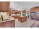 Stylish kitchen featuring granite countertops, a central island, stainless steel appliances and lots of cabinets at 2383 E Zion Way, Chandler, AZ 85249