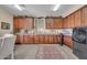 Well-appointed laundry room with extensive cabinet storage, sink, and modern appliances at 2383 E Zion Way, Chandler, AZ 85249