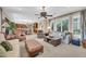 Comfortable living room featuring a ceiling fan, a glimpse of an adjacent kitchen, and ample seating at 2383 E Zion Way, Chandler, AZ 85249