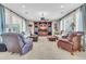 Bright living room featuring a ceiling fan, recessed lighting, comfortable seating, and built-in entertainment center at 2383 E Zion Way, Chandler, AZ 85249