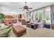Comfortable living room with open floor plan, ceiling fan, and natural light at 2383 E Zion Way, Chandler, AZ 85249