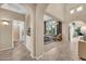 Open-concept living room with large windows, elegant furnishings, and a view of the backyard at 2383 E Zion Way, Chandler, AZ 85249