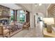 Bright living room featuring a fireplace, comfortable seating, stylish decor, and tile flooring at 2383 E Zion Way, Chandler, AZ 85249