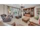 Spacious living room features plush seating, entertainment center, and large windows with bright natural light at 2383 E Zion Way, Chandler, AZ 85249