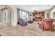 Spacious living room features neutral carpet, recessed lights, and entertainment center at 2383 E Zion Way, Chandler, AZ 85249