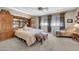 Bedroom features carpet, built-in cabinets, large windows, seating area, and light walls at 2383 E Zion Way, Chandler, AZ 85249
