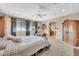 Bedroom features include carpet, en suite bath entrance, seating area, and large windows at 2383 E Zion Way, Chandler, AZ 85249