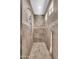 Walk-in shower with tile surround, shower head, hand sprayer, and decorative accent tile at 2383 E Zion Way, Chandler, AZ 85249