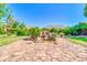 Backyard oasis featuring a gorgeous rock water feature and lush landscaping at 2383 E Zion Way, Chandler, AZ 85249