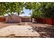Large backyard featuring mature trees, a fire pit, and ample space, perfect for outdoor living at 240 N Monte Vista St, Chandler, AZ 85225