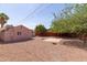 Expansive backyard featuring ample space, mature trees, and a storage shed at 240 N Monte Vista St, Chandler, AZ 85225