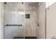 Sleek bathroom featuring a glass-enclosed shower with modern tile, fixtures, and hardware at 240 N Monte Vista St, Chandler, AZ 85225