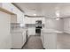 Kitchen featuring white cabinets, stainless steel appliances and island with modern tile detail at 240 N Monte Vista St, Chandler, AZ 85225