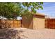 Storage shed with brown trim and a fenced-in yard provides secure space for all your storage needs at 240 N Monte Vista St, Chandler, AZ 85225