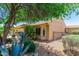 Beautiful backyard landscaping with a covered patio perfect for enjoying the outdoors at 27244 W Potter Dr, Buckeye, AZ 85396