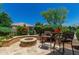 Secluded backyard fire pit and outdoor seating is the perfect space for relaxing at 27244 W Potter Dr, Buckeye, AZ 85396
