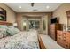 Cozy bedroom featuring a bay window with natural light, a ceiling fan, and wood furniture at 27244 W Potter Dr, Buckeye, AZ 85396