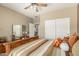 Bedroom with a decorative mirror on the dresser and sliding closet doors at 27244 W Potter Dr, Buckeye, AZ 85396