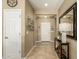 Neutral entryway features tile flooring, a console table, and a decorative mirror at 27244 W Potter Dr, Buckeye, AZ 85396