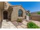 Charming front porch with a seating area and desert landscaping at 27244 W Potter Dr, Buckeye, AZ 85396