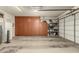 Spacious garage features built in cabinets and shelving for all your storage needs at 27244 W Potter Dr, Buckeye, AZ 85396