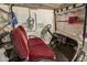 Close-up view of the included golf cart featuring comfortable red seating and all-weather protection at 27244 W Potter Dr, Buckeye, AZ 85396