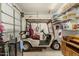 Spacious garage featuring an included golf cart and ample shelving and storage for organization at 27244 W Potter Dr, Buckeye, AZ 85396