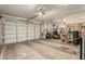 Expansive three car garage with the included golf cart and extra storage space at 27244 W Potter Dr, Buckeye, AZ 85396