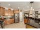Spacious kitchen features granite countertops, stainless appliances, and seamless flow to other rooms at 27244 W Potter Dr, Buckeye, AZ 85396