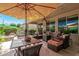 Inviting outdoor living space with patio, seating, dining area and covered patio at 27244 W Potter Dr, Buckeye, AZ 85396