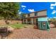 Spacious backyard featuring lush lawn, patio, and a charming playhouse perfect for outdoor fun at 2748 E Dennisport Ave, Gilbert, AZ 85295