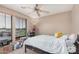 Bright bedroom with natural light, ceiling fan, and a comfortable bed at 2748 E Dennisport Ave, Gilbert, AZ 85295