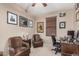 Cozy bedroom features wood accents and comfortable office and sitting space at 2748 E Dennisport Ave, Gilbert, AZ 85295