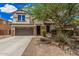 Charming two-story home with a well-maintained lawn and a two-car garage at 2748 E Dennisport Ave, Gilbert, AZ 85295