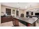 Gorgeous island kitchen featuring granite countertops, stainless appliances, and ample cabinetry at 2748 E Dennisport Ave, Gilbert, AZ 85295