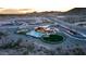 Aerial view showcases the community clubhouse, pool, playground, and desert landscape at 32487 N 122Nd Ave, Peoria, AZ 85383
