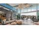Clubhouse lounge features soaring windows with a mountain view, stylish sofas and decor at 32487 N 122Nd Ave, Peoria, AZ 85383