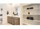 Bright bathroom showcasing a double vanity with lots of storage and shelving at 32693 N Jasper St, San Tan Valley, AZ 85143