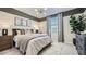 Serene bedroom with a plush bed, soft lighting, and stylish decor, creating a tranquil retreat for rest and relaxation at 32693 N Jasper St, San Tan Valley, AZ 85143