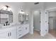 Spacious bathroom featuring double sinks, white cabinetry, and a walk-in closet at 3624 N Paseo Del Sol --, Mesa, AZ 85207