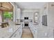 Bright kitchen featuring white cabinetry, stainless steel appliances, and a large window providing natural light at 3624 N Paseo Del Sol --, Mesa, AZ 85207