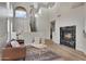 Grand living room with high ceilings, a fireplace, and large windows that flood the space with light at 3624 N Paseo Del Sol --, Mesa, AZ 85207