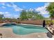 Backyard pool area features a basketball hoop and elevated jacuzzi with a desert landscape at 3624 N Paseo Del Sol --, Mesa, AZ 85207