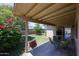 Inviting covered patio overlooking a lush backyard with vibrant greenery at 3633 W Redfield Rd, Phoenix, AZ 85053