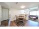 Dining area featuring wood table and chairs, adjacent to the living area at 3633 W Redfield Rd, Phoenix, AZ 85053