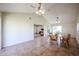 Inviting dining room with an open layout, seamlessly connected to the living area and featuring a round wooden table at 3633 W Redfield Rd, Phoenix, AZ 85053