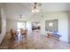 Dining area with a round table, seating, vaulted ceilings, and a smooth transition to the outdoor patio and living areas at 3633 W Redfield Rd, Phoenix, AZ 85053